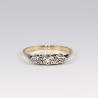 A gold Testing as 18ct, 5 stone diamond illusion set ring, size R, 2.4g
