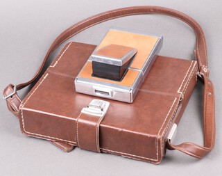 A vintage Polaroid SX-70 Land camera complete with carrying case 