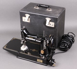 A Singer Featherweight electric sewing machine complete with foot control in original carrying case 