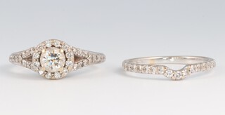 An 18ct white gold diamond cluster ring size M, together with an ensuite 18ct white gold and diamond set wedding band, size M, gross weight 6g