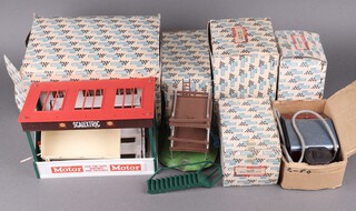 A collection of early Scalextric mini models scenery to include A203 owner's stand and pit, A201 event board and hut, F320 TV camera and crew set, A228 refreshment kiosk and A209 grand stand, all boxed, together with a power supply 