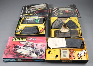 A collection of 3 vintage boxed Scalextric sets to include CM33 (including a Lotus 1961 car and a BRM MM/C.59,) a similar early set containing only rusted track and a Spanish GP.26 set complete with track and together with  2 Sigma cars 
