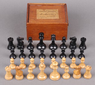 A set of 32 "Genuine Staunton Chessmen" by J Jaques & Son London, the pieces in boxwood and ivory with individual knight and rook red crowned, contained in a polished wooden box with baize lining, Jaques label to lid 