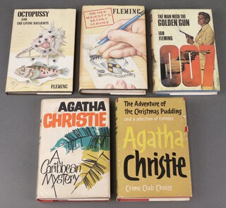 By Ian Fleming and Agatha Christie, a compilation of books to include by Fleming "Octopussy and The Living Daylights", 1st Ed. 1966, "The Man with the Golden Gun" Book Club edition, "On Her Majesty's Secret Service" 1st Ed. 1963, by Christie "A Caribbean Mystery" 1st Ed. 1964, "The Adventures of The Christmas Pudding" 1st Ed. 1960, all books with dust covers 