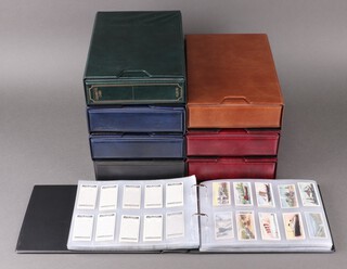 Eight binders of mainly post 1920's cigarette cards, of note Raemaekers War Cartoons by Carreras (incomplete) and Fortune Telling by Carreras (incomplete)