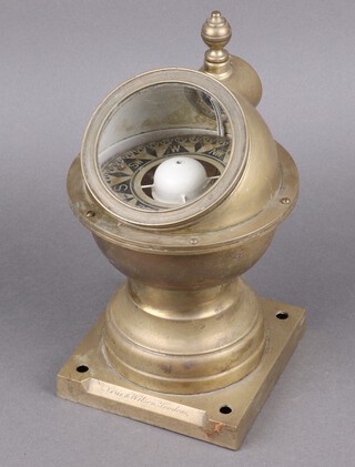 A compass contained in a brass binnacle the base marked Mouie and Wilson London 28cm 