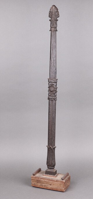 A Regency cast iron and wooden door stop 83cm h x 16cm w x 8cm d 