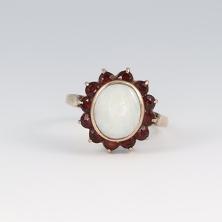 A 9ct gold opal and garnet cluster ring, size K 1/2, 2.6g