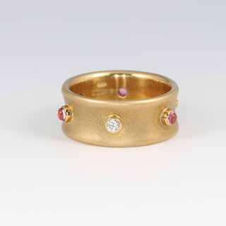 An 18ct gold diamond and gem set ring, size N 1/2, 9.6g
