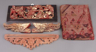Two sections of gilt painted Chinese carved panel  6cm x 14cm, decorated Ho-Ho birds, a rectangular pierced and carved panel 14cm x 34cm, 1 other small section of panel 10cm x 35cm and a rectangular section of fabric 197cm x 37cm 