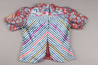 A Chinese late 19th/early 20th Century lady's tunic, embroidered dragons and waves with possible later alteration to back