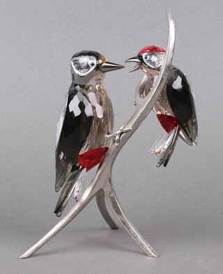 A Swarovski Crystal  2012 figure of woodpeckers - Woodpeckers Paradise black diamond on a metal stand, 22cm, boxed 