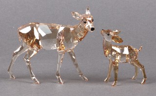 A Swarovski Crystal  2012 figure of a fawn and doe - Golden Shadow, 8cm and 6cm, boxed 
