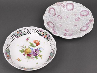 A Meissen circular porcelain bowl with floral decoration, base incised H149, impressed 23 and with crossed sword mark 25cm together with a German pierced porcelain dish with floral decoration, impressed 494 24cm  