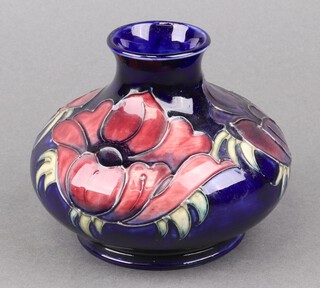 A Moorcroft anemone pattern squat shaped vase, base impressed Moorcroft WM Made in England 11cm 