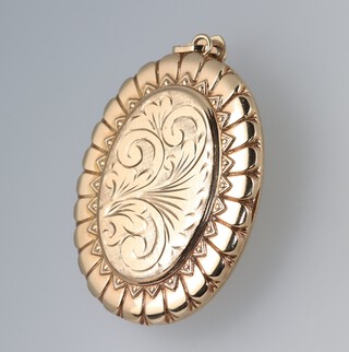 An oval 9ct gold locket with foliate decoration, 5.5cm, 23 grams gross