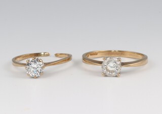 A 9ct gold cubic zirconia set ring, size T 1/2 and one other 1 cut, 4.5g gross 