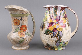 A Burleigh Art Deco jug with floral decoration, the base marked 5035 20cm, together with a Royal Winton Art Deco pottery jug with floral decoration 19cm 