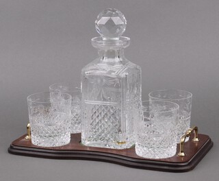 A Stuart Crystal Beaconsfield pattern cut glass spirit decanter and stopper 26cm, together with 4 cut glass whisky tumblers, all on a shaped twin handled tray 