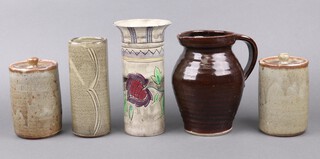 An Art Pottery vase the base incised Medina Shorter England, 22cm, an Art Pottery vase impressed E P 19cm, a pottery jug of ribbed form impressed R L 19cm and 2 cylindrical jars and covers (chips to lids) 14cm 