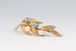 A 9ct gold leaf shaped brooch set topaz and pearls, 5.5cm w, 6.4g