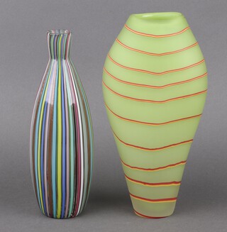 A glass club shaped candy striped vase 25cm and a green and red striped glass vase 27cm 