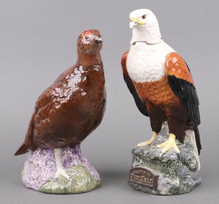 A Royal Doulton liqueur decanter in the form of a grouse containing Grouse whisky (seal loose), 22cm and 1 other Fish Eagle decanter - Flight of the Fish Eagle natural brandy (some spirit loss) 22cm 