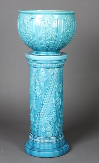 An Edwardian blue glazed Burmantofts jardiniere and stand with panelled decoration, the jardiniere impressed 1857 D 37cm (heavily glued), the stand impressed 944 D 68cm h (scratches in places) 