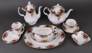 A 119 piece Royal Albert Old Country Rose pattern dinner/tea service comprising 9 dinner plates (1 rings flat), 10, 21cm side plates (2 seconds), 8, 18cm tea plates (7 seconds, 2 ring flat), 12 tea plates (3 seconds), oval meat plate, sauce boat and stand (stand is a second), 7 twin handled soup bowls (1 with chip to rim), tea pot, coffee pot, circular plate with side handle (second), small boat shaped dish (second), large sugar bowl, small sugar bowl (second), cream jug, lidded sugar bowl, pepper pot, 4 tier cake stand (centre section missing), 9 square shallow dishes (8 seconds), 13 tea cups (3 seconds), 12 tea saucers (9 seconds) 8 coffee cups (1 second),  9 coffee saucers (3 seconds), 3 saucers/plates (all seconds), 3 circular butter dishes (2 seconds) 
