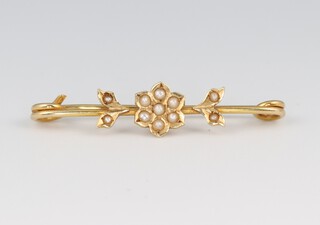 A gold marked 15ct demi-pearl set brooch 3.5cm w, 1.5g