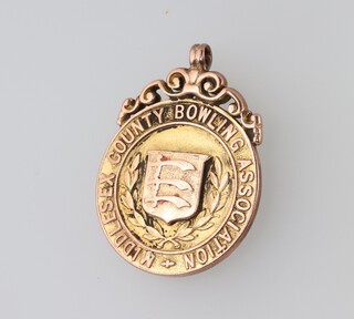 A 9ct gold Middlesex County Bowling Association medal, engraved to the reverse RINK Championship 1919 E. Glen with pendant mount 9.7g gross