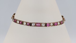 A yellow metal and paste set bracelet 19cm