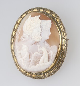 An oval shell carved cameo brooch of classical figures, in a gilt metal mount 5.5cm x 4.5cm (excluding mount)