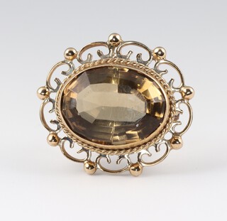 A gold testing as 9ct brooch set a citrine, 2.8cm w, 6.8g