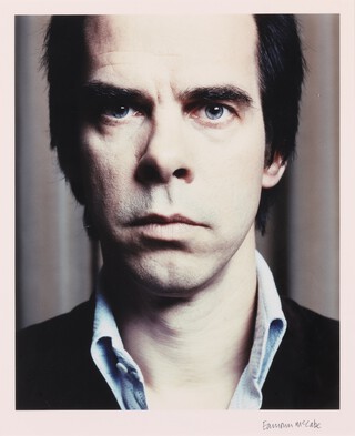 Eamonn McCabe (1948-2022), Portrait of Nick Cave, colour photograph, signed in ink, 48cm x 39cm, within an ebonized frame.