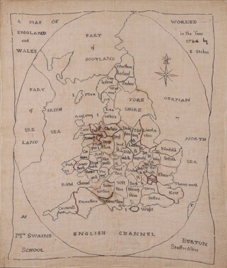 An 18th century needlework sampler map of England and Wales by Sarah Stokes of Mrs Swains School, Burton, Staffordshire, dated 1784 recto, label with biographical details verso, within an ebonised frame.