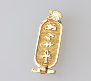 An Egyptian yellow metal pendant, 3.7g