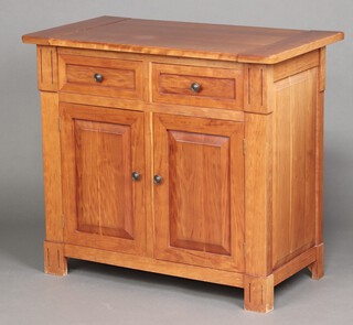 A hardwood cabinet fitted 2 drawers above panelled doors 90cm h x 101cm w x 55cm d