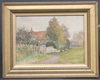 An Edwardian watercolour drawing, study of a country cottage with stone wall and 5 bar gate, monogrammed E W H 25cm x 35cm 