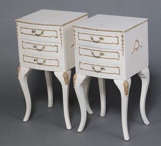 A pair of white and gilt painted Louis style bedside chests of 3 drawers, raised on cabriole supports 68cm h x 36cm w x 33cm d 