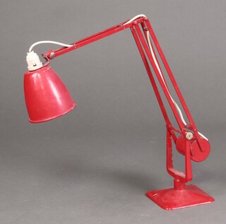 A mid-century red metal anglepoise lamp on a square base 69cm h  