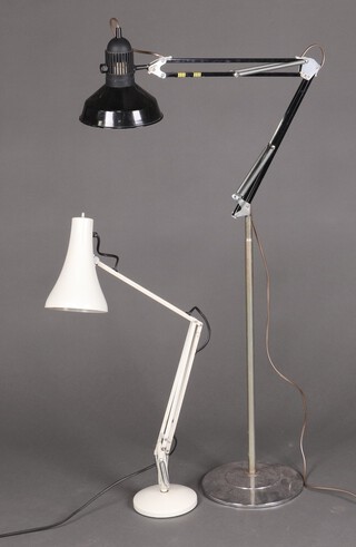 A black painted metal anglepoise style lamp and a white ditto 