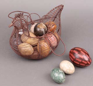 A wire work model chicken containing a collection of hardstone eggs 21cm 
