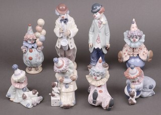 Eight Lladro figures of clowns - 5472 Circus Sam, 5278 Pierrot with Puppy and Ball, 5471 Sad Sax,  Tired Friend 5812, Having a Ball 5813, 5277 Seated Pierrot with Puppy, Littlest Clown 5811, Pierrot with Concertina 5279  