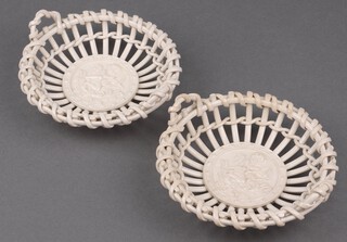 A pair of Continental white glazed ribbon ware twin handled dishes decorated cupid, the base incised 6437 17cm 