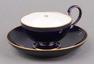 A 19th/20th Century Sevres Coalport blue and gilt tea cup and saucer, the base incised AGL 48 Sevres  (contact marks in places)