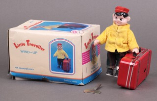 A Chinese Little Traveller tin plate and fabric clockwork figure, boxed