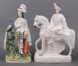 A 19th Century Staffordshire flat back figure of a mounted highlander 36cm and 1 other of a standing highlander with peacock and musical instrument 37cm  (f and r) 