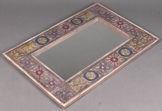 A rectangular plate mirror contained in a carved wooden frame 97cm x 65cm 
