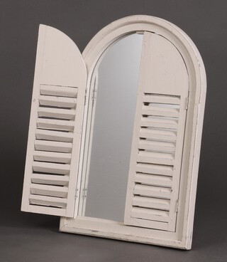 An arched plate mirror contained in a white painted frame with Louvre shutters to the front 58cm h x 38cm d 